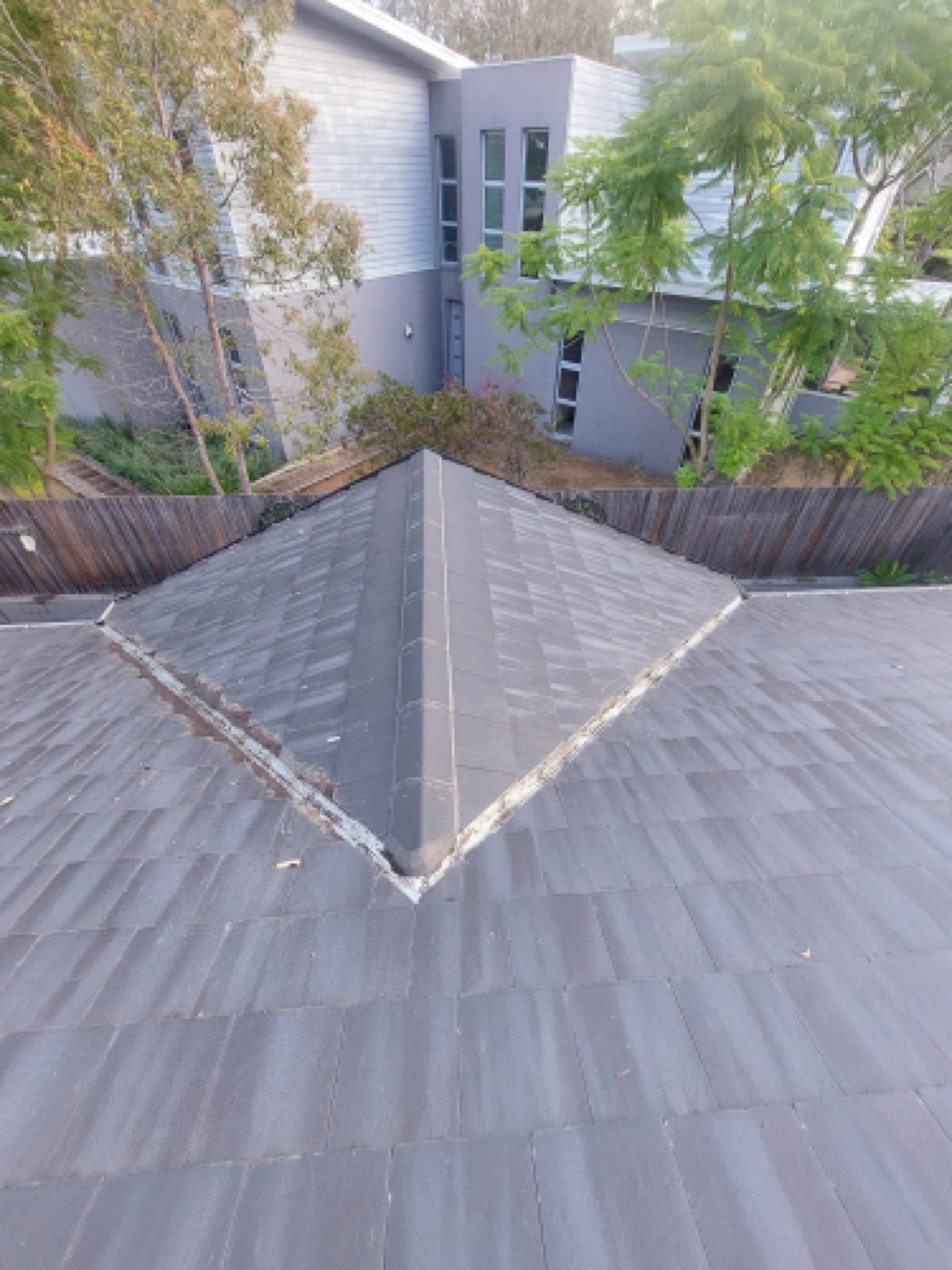 Tile roof ridge and valley on a Hunter Valley home before restoration