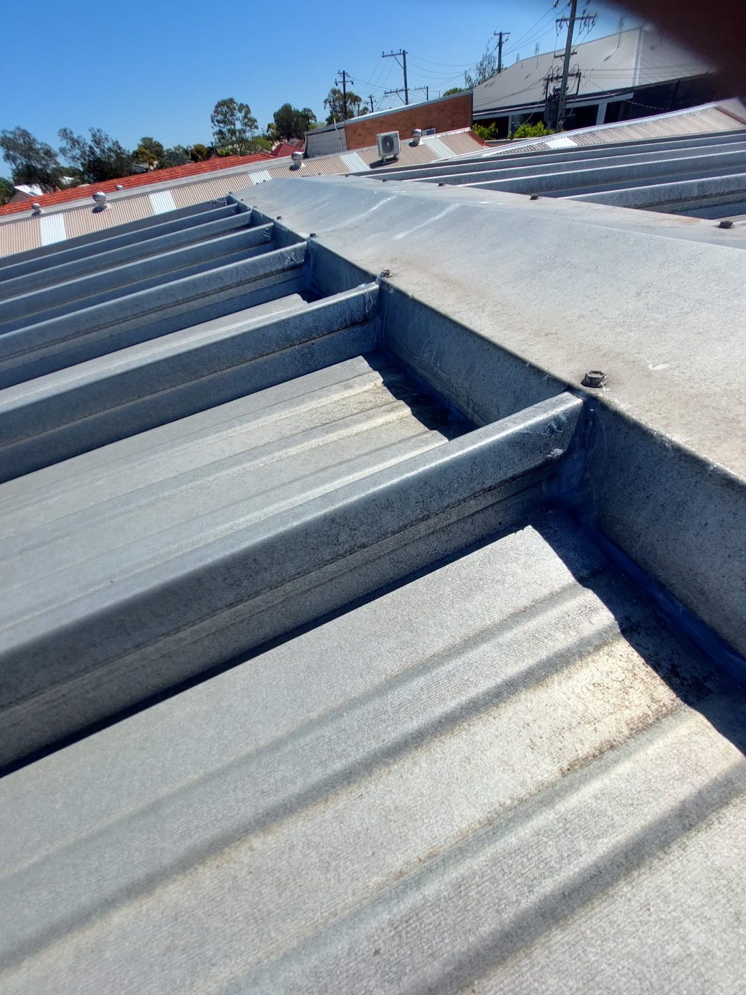 Newly laid metal roof sheeting with clean flashing detail