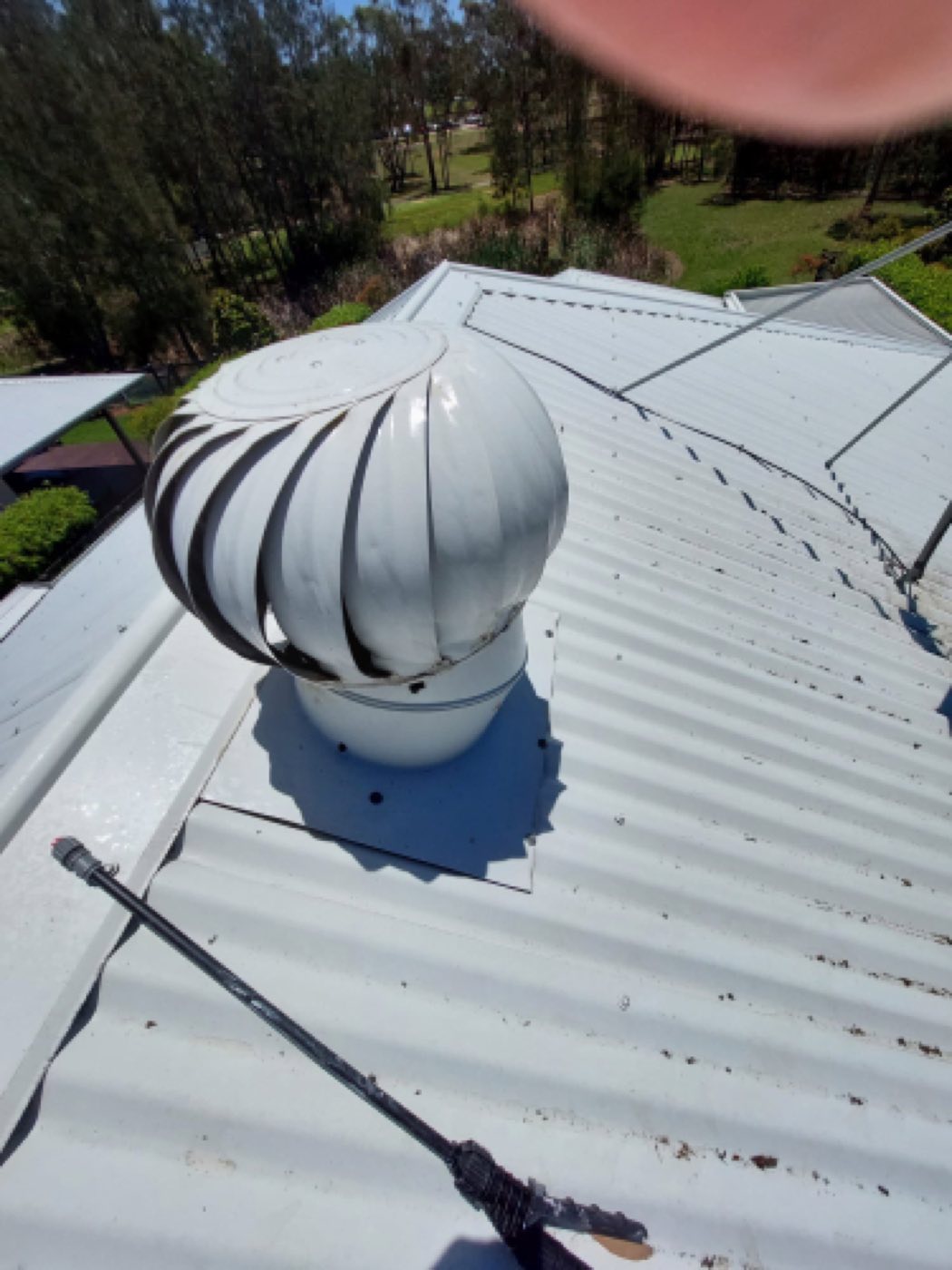 Whirlybird roof vent checked during a scheduled maintenance visit